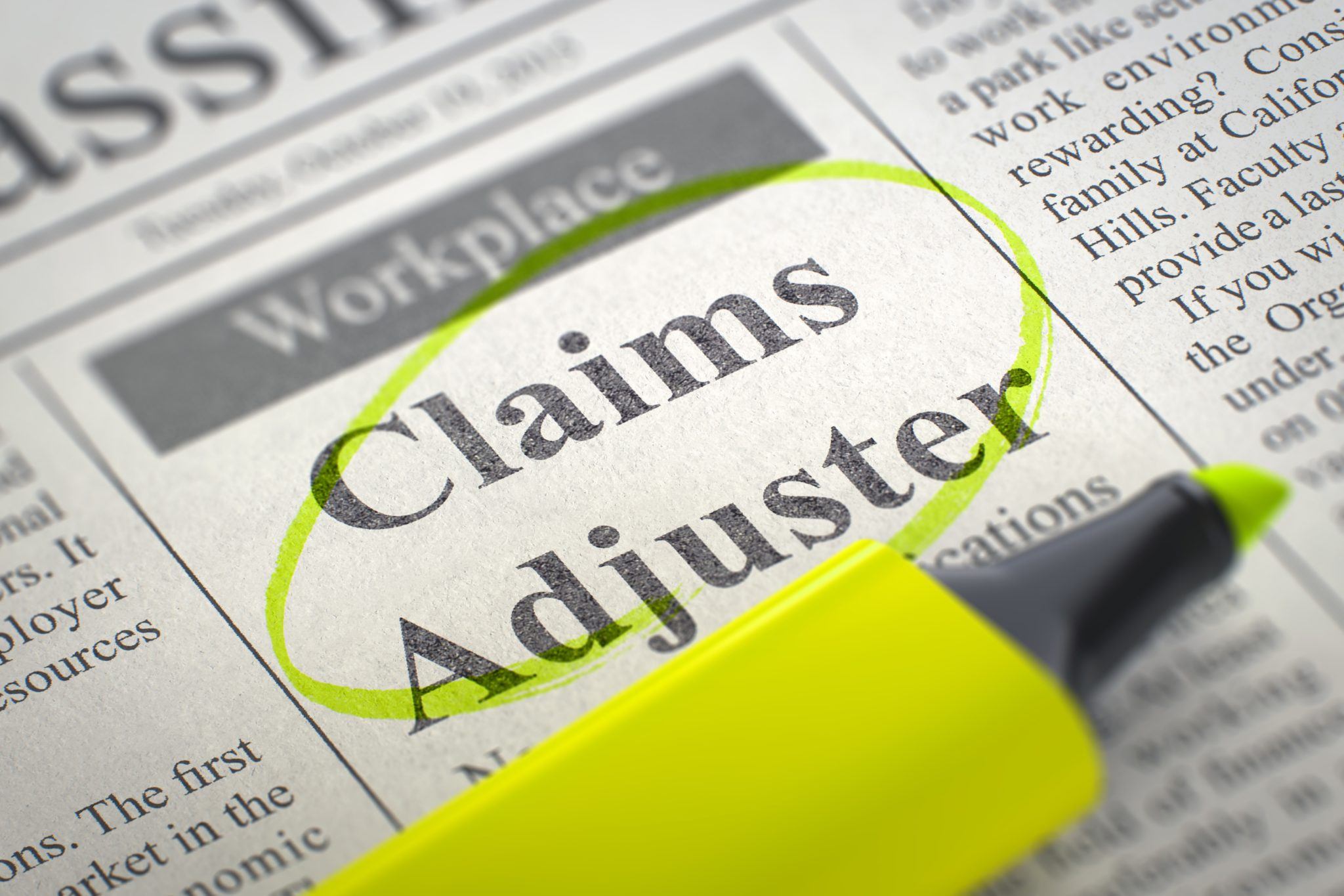 Newspaper with Classified Advertisement of Hiring Claims Adjuster. Blurred Image with Selective focus. Hiring Concept. 3D Render.