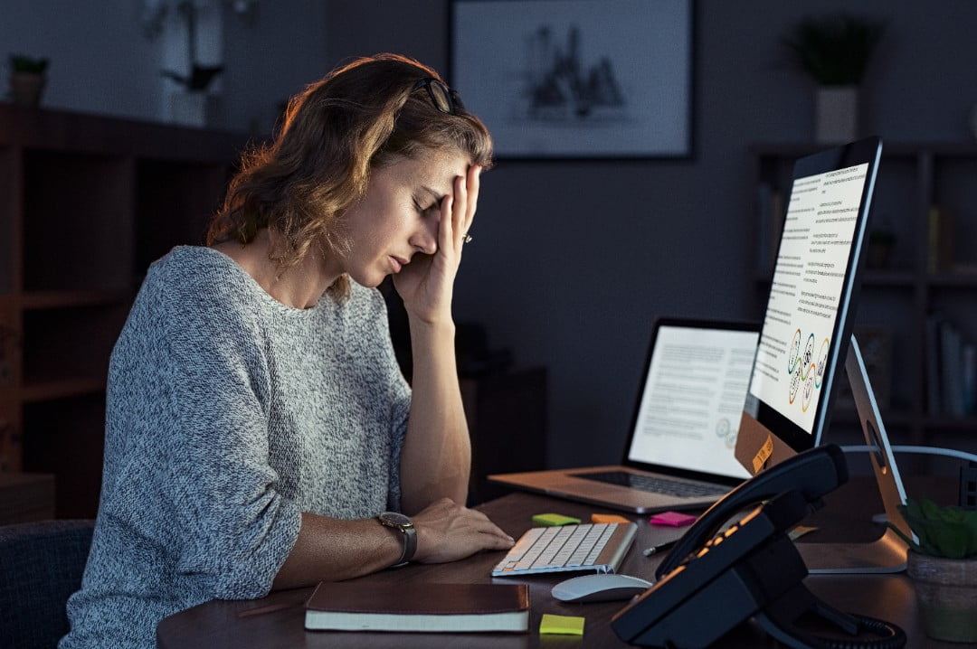 woman at computer with burnout