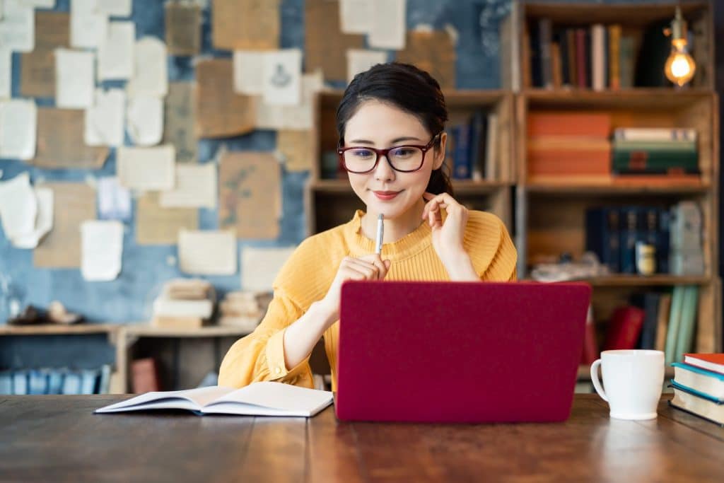 A woman studying for the TDI insurance exam to become a texas insurance adjuster